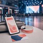 Abstract mobile ticket, wristband, and small bag at an event venue