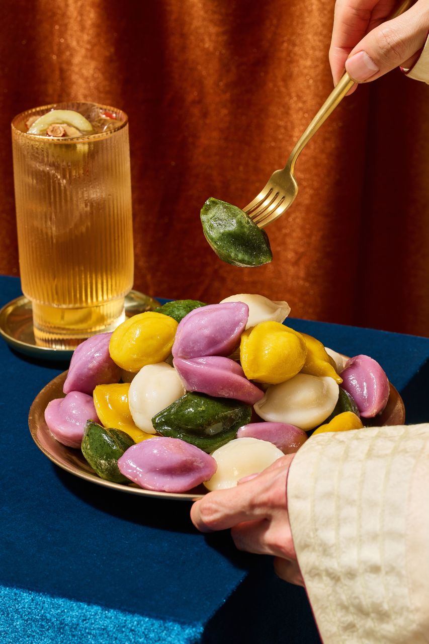 Colourful songpyeon rice cakes arranged on a plate