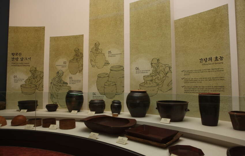 Illustrated fermentation-history panels and earthenware jars inside Sunchang Jangryu Museum